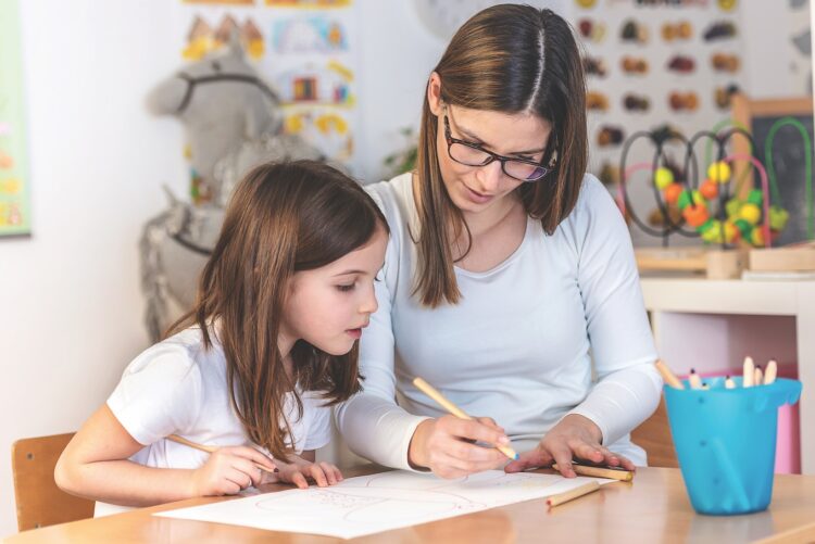 Teacher Mom working with Creative Kid