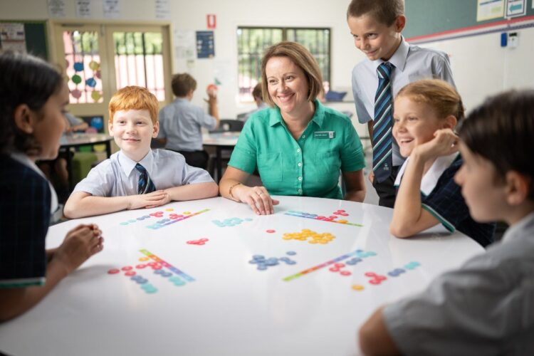 Flinders specialist Narelle Goan with Primary students. Image: Matthew Flinders Anglican College.