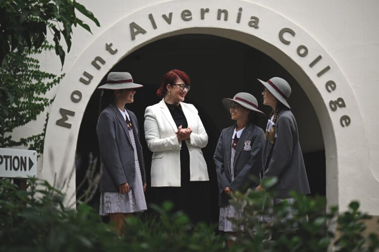 Principal Samantha Jensen with students at the College entrance. Images: Mount Alvernia College